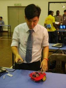 KBU International College Final year 3+0 Sheffield Hallam University's electrical & electronic engineering student, Ng Wern Jun, controlling the PSoc-Based Robot with the Android App in his mobile phone using Bluetooth.